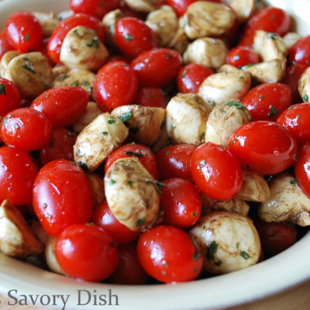 Caprese salad is a healthy summer salad, with fresh garden tomatoes, fresh basil, and fresh mozzarella cheese.