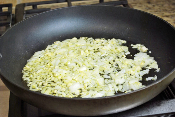 Onions sauteeing in a skillet