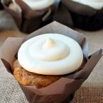 pumpkin cupcake with a swirl of maple frosting on top