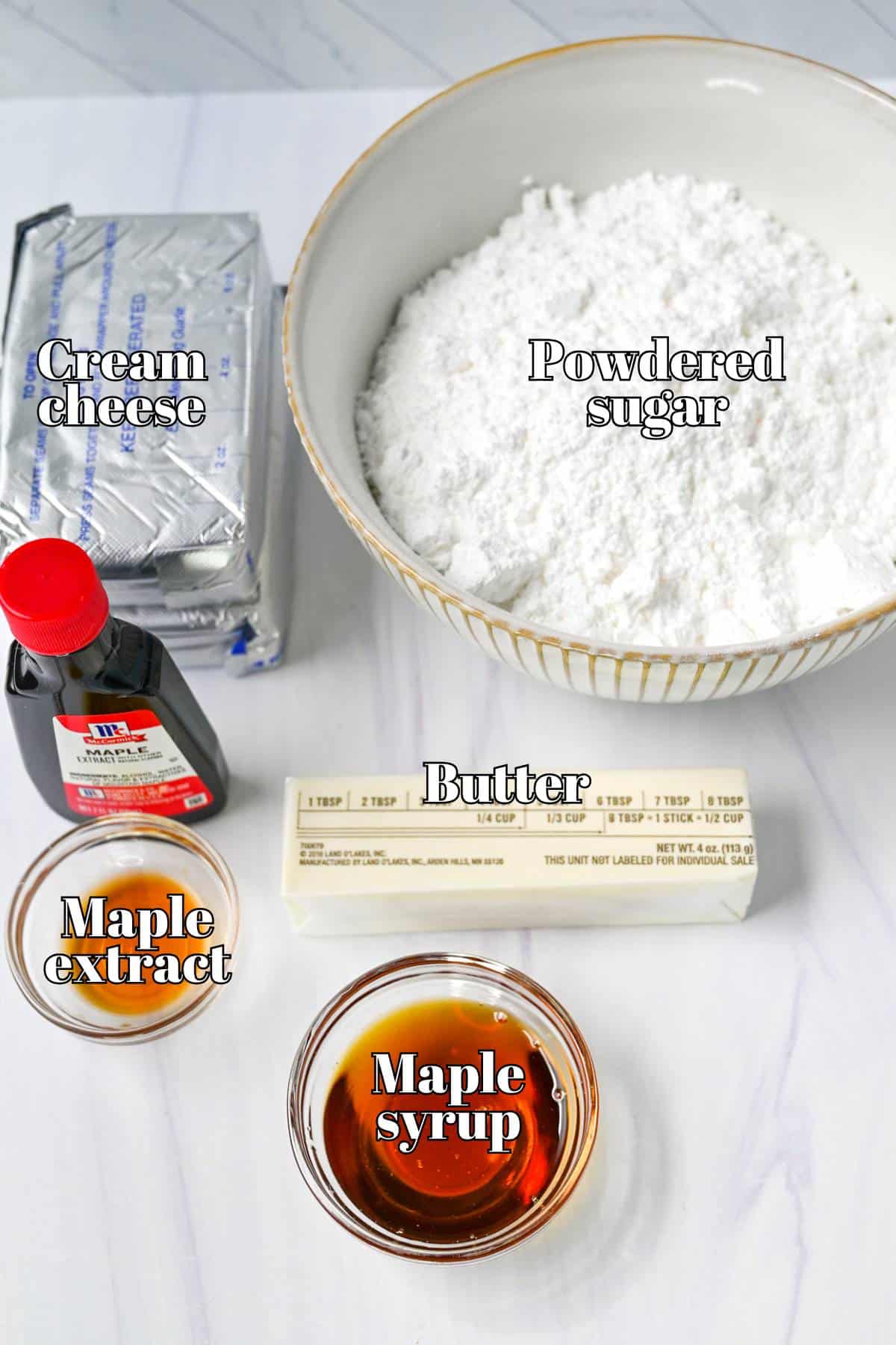 ingredients for maple cream cheese frosting measured out on a counter