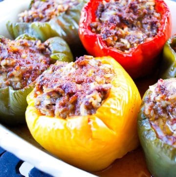 colorful stuffed peppers in a baking dish ready to serve