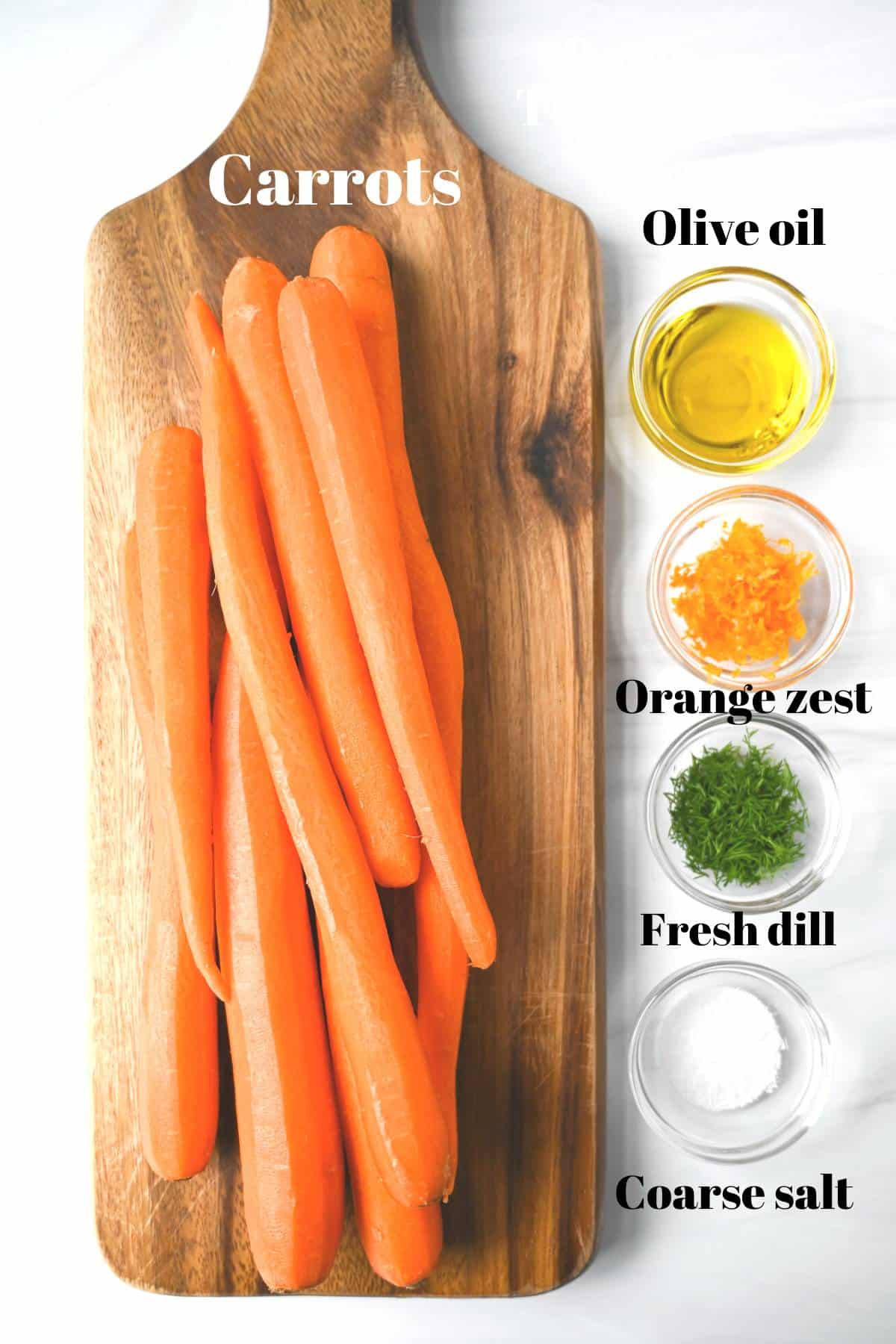 peeled carrots on a cutting board with olive oil, dill, orange zest and salt in little dishes