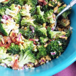 Prepared broccoli salad in a blue bowl