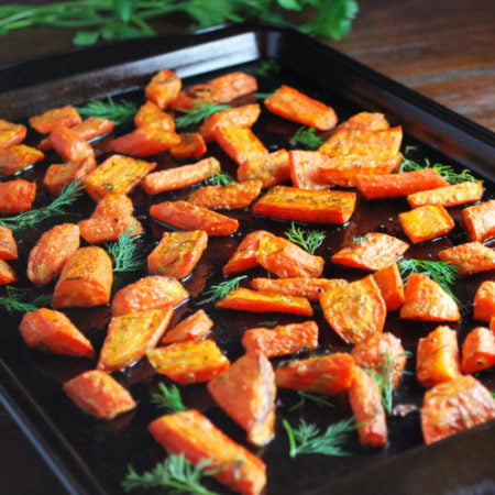 This is the best recipe for herb roasted carrots made with olive oil and fresh dill and makes the perfect holiday side dish.