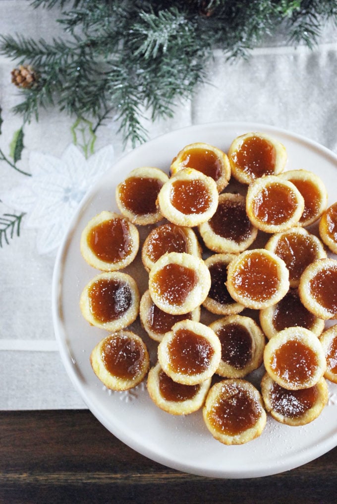 A plate of Apricot tarts dusted with powdered sugar