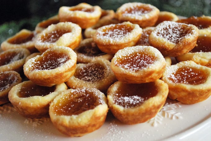 A close up of cookie tarts with apricot filling