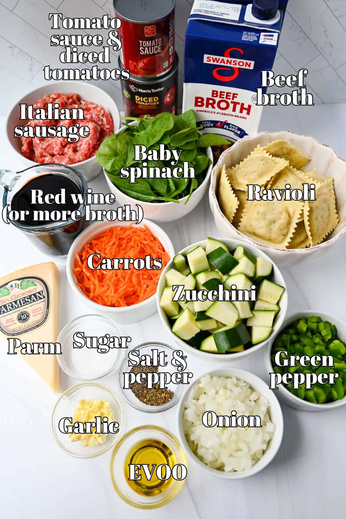 ingredients for soup with ravioli, vegetables, and Italian sausage measured out on a counter top