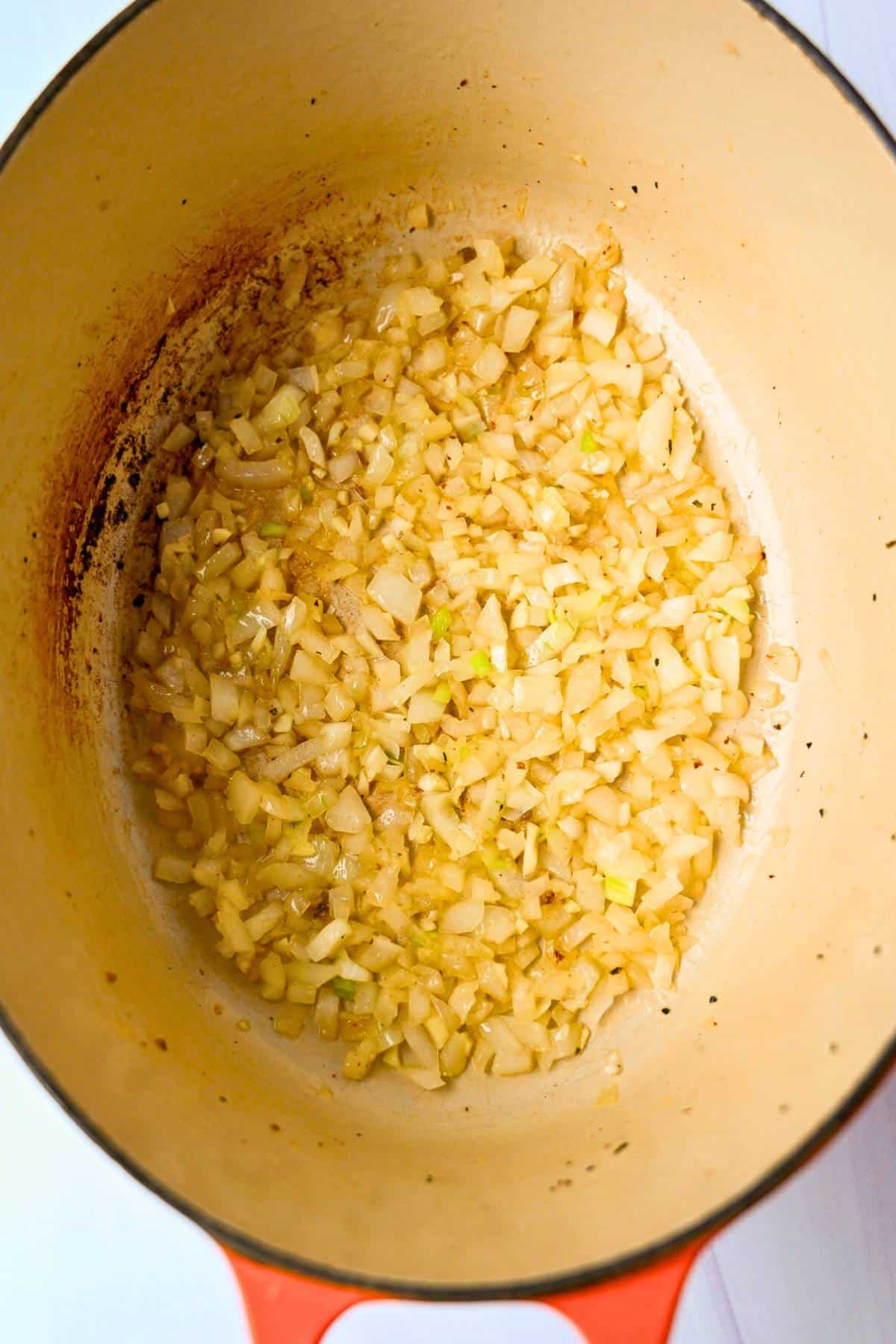 sauteed garlic and onions in olive oil in a dutch oven