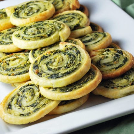 Spinach pinwheels on a white platter