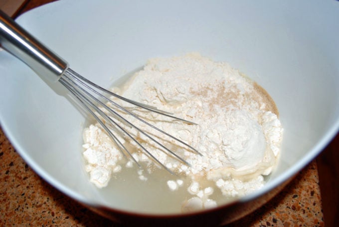 flour, yeast and water mixed in a bowl
