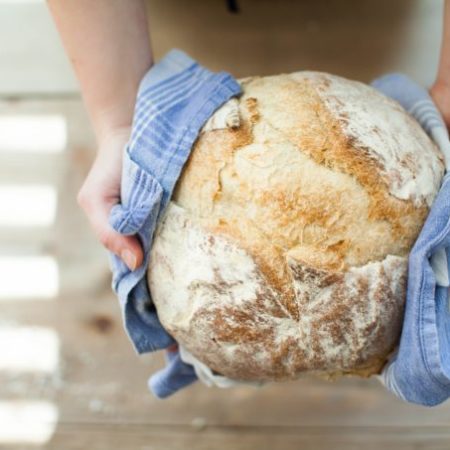 photo of a loaf of bread in hands
