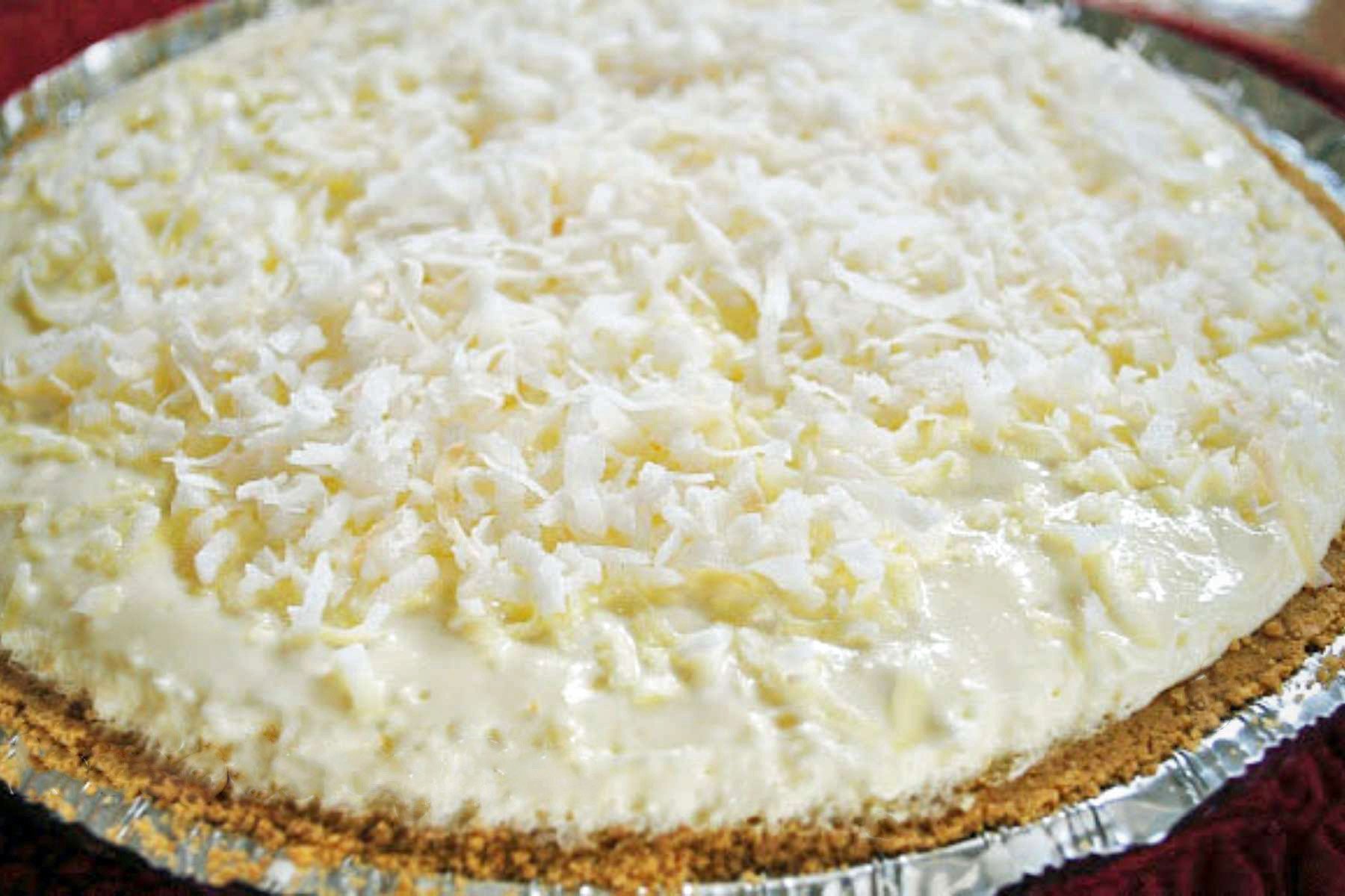 A whole coconut pie on a table