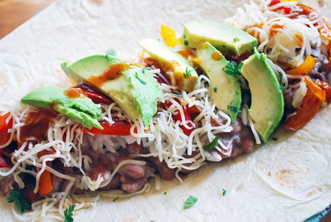 Assembling an easy Mexican burrito made with homemade pinto beans