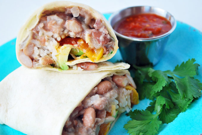 homemade bean burrito and salsa on a plate