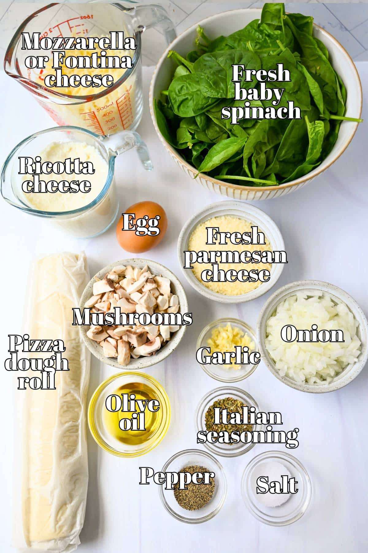 ingredients for spinach calzones measured out on a counter