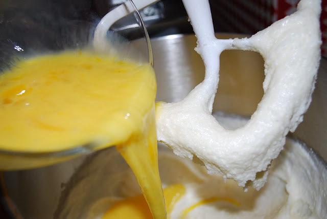 adding the eggs to the Queen cake batter