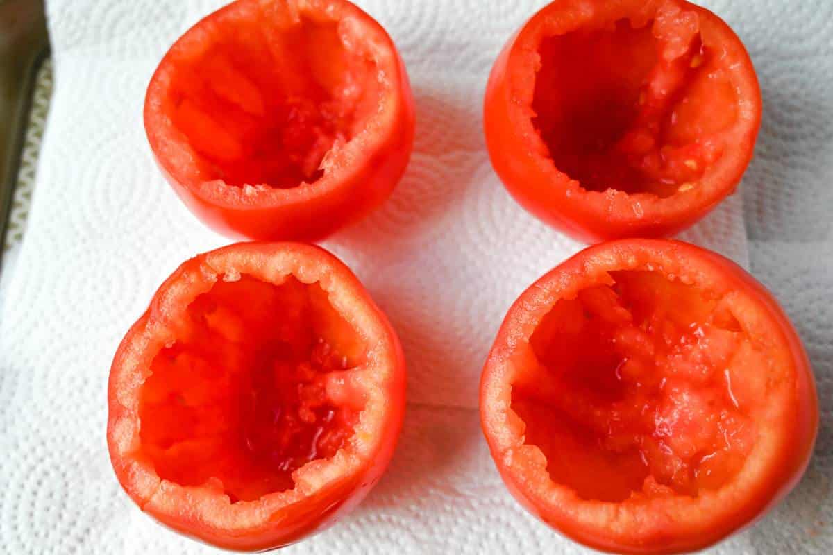 tomatoes sliced in half with the center hollowed out