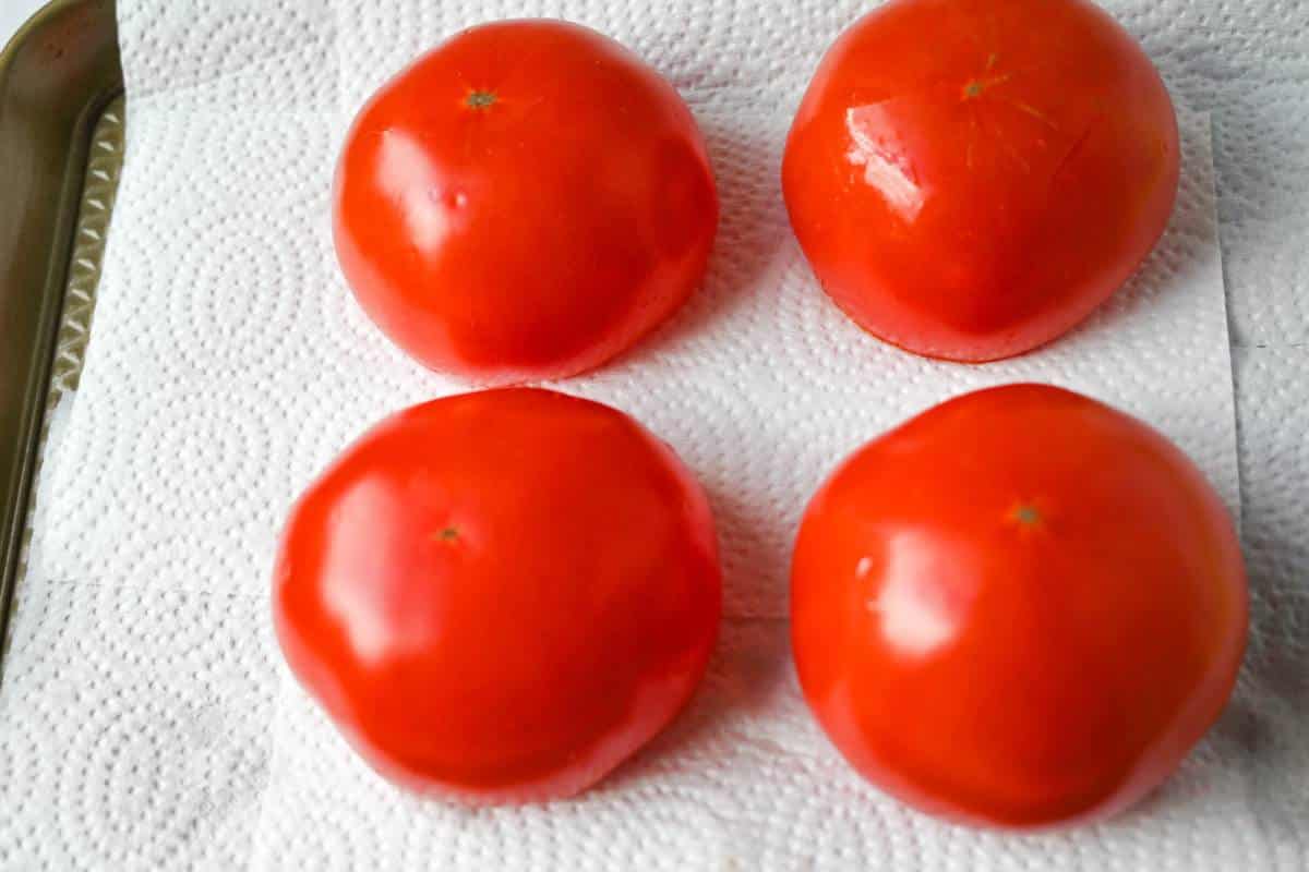 tomatoes sprinkled with salt and turned upside down to drain on paper towels