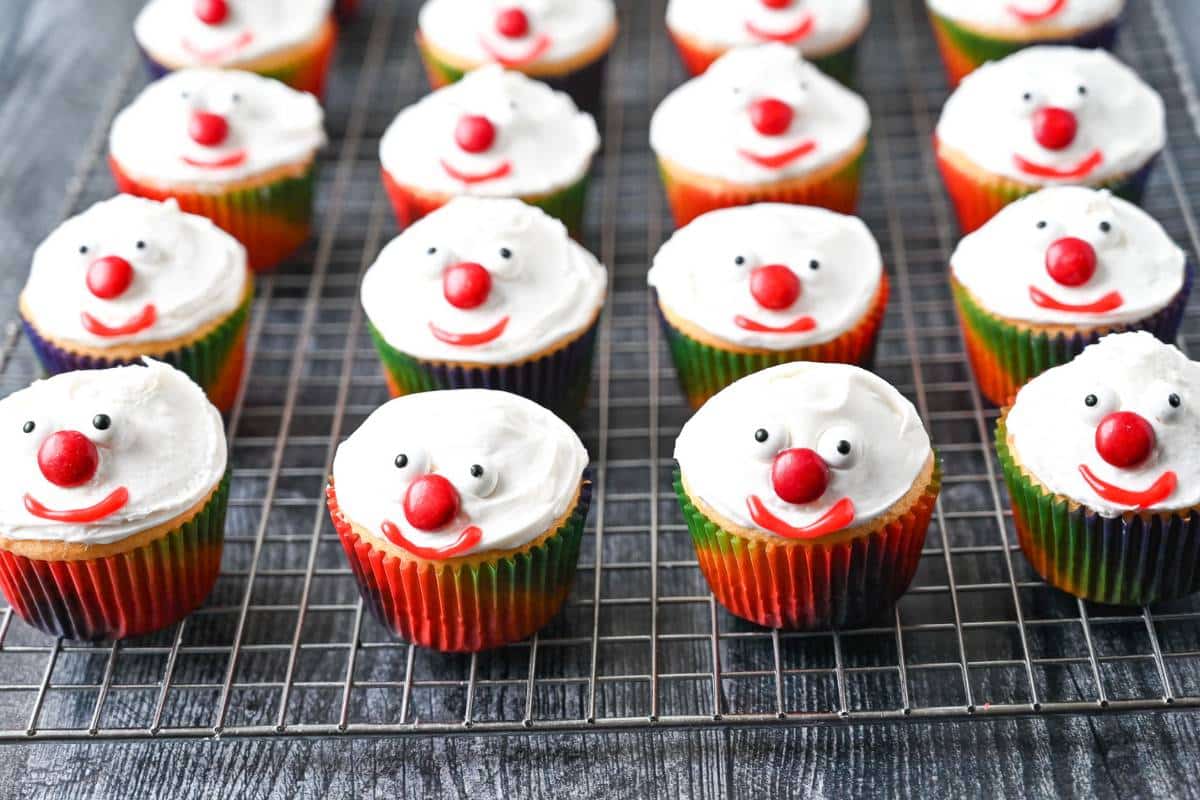 clown cupcakes with candy eyes, a red M&M nose, and a red icing mouth