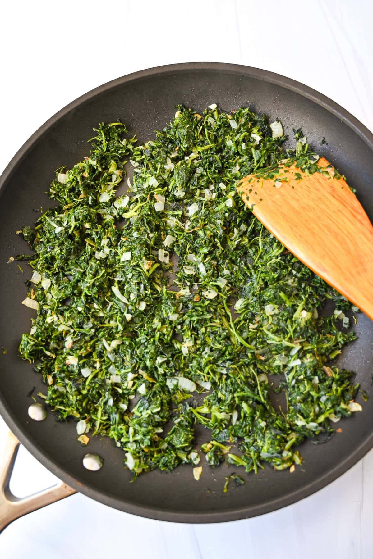 sauteed spinach and garlic in a skillet