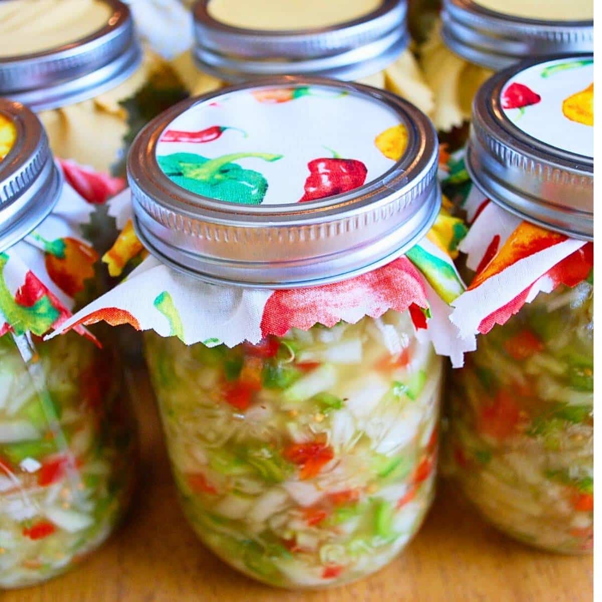 jars of homemade relish on a table