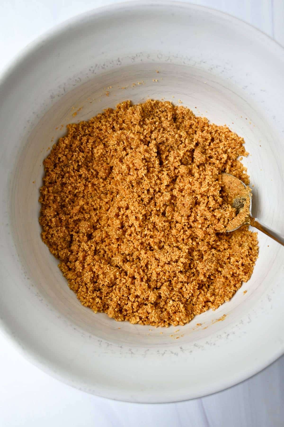 graham cracker pie crust mixture in a bowl
