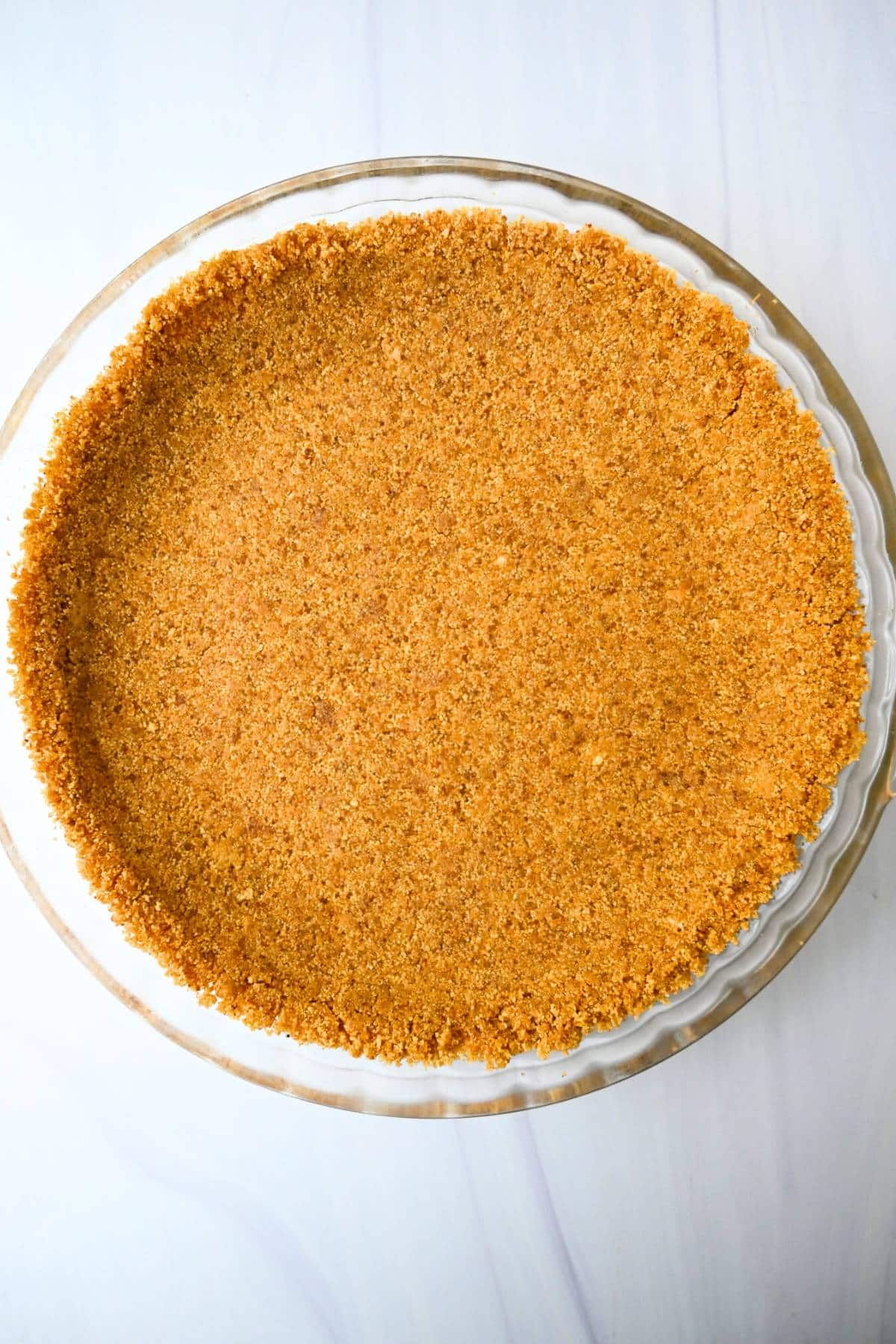 graham cracker crust mixture pressed into a pie plate