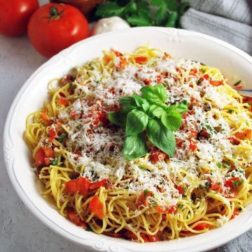 bowl of pasta tossed with fresh tomato basil pasta sauce
