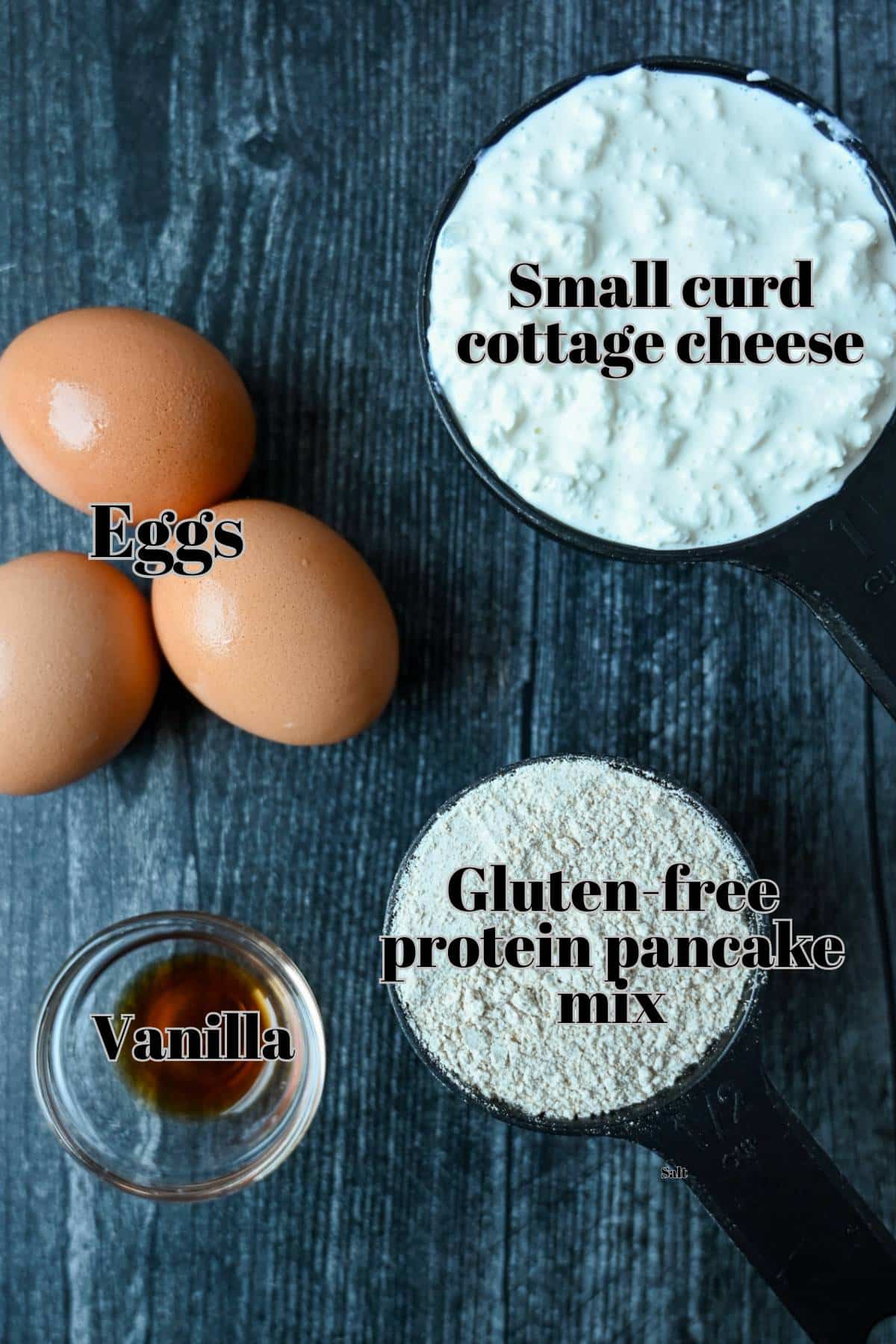 four ingredients for cottage cheese pancakes measured out on a counter