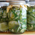 3 quart mason jars of pickled cucumber salad