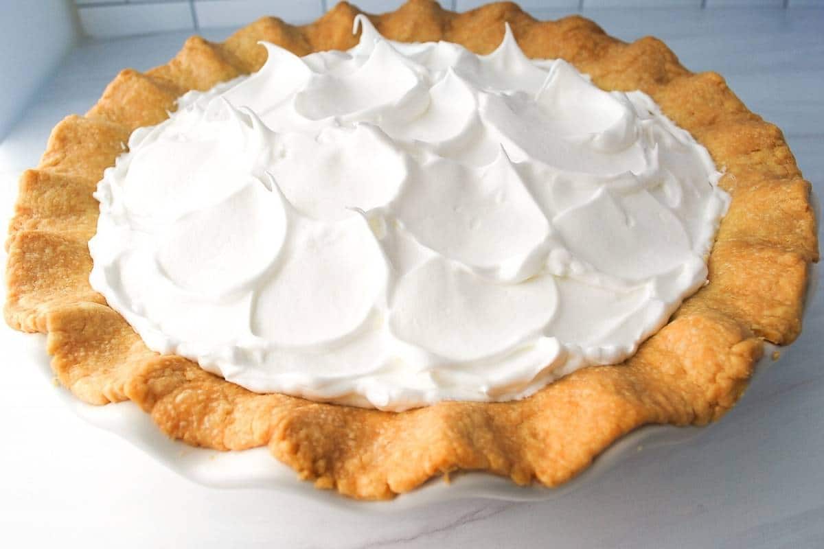 meringue topped on a pie ready to bake