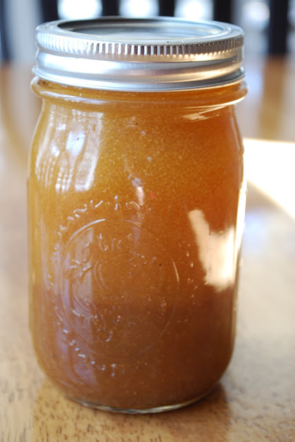 A close-up photo of dressing in a jar for purple cabbage salad