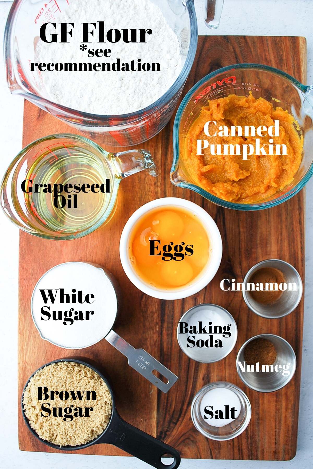 ingredients for gluten-free pumpkin bread on a wooden board