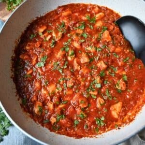 salsa chicken with chopped fresh cilantro in a skillet