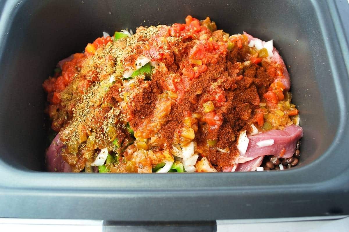 pork tenderloin chili ingredients in a slow cooker ready to cook