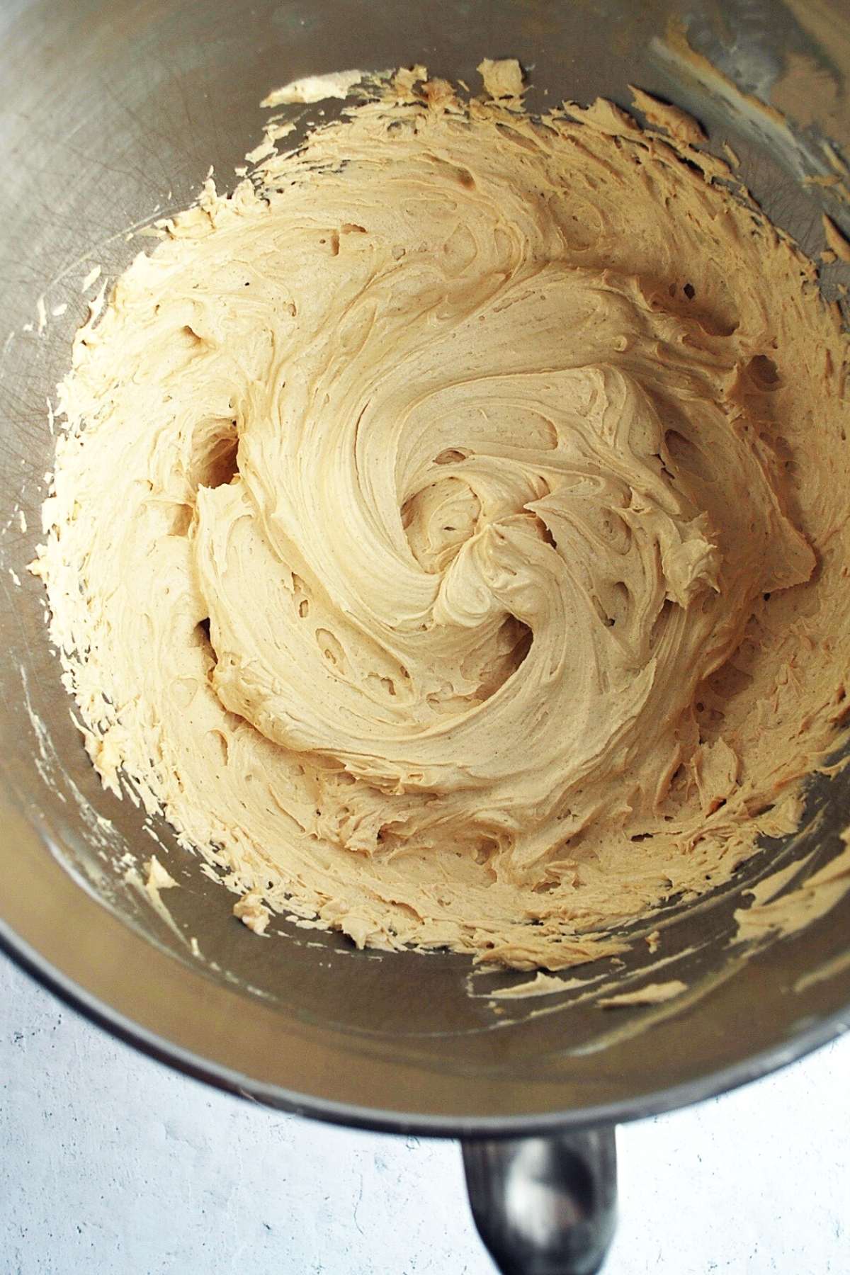 peanut butter frosting in a mixing bowl