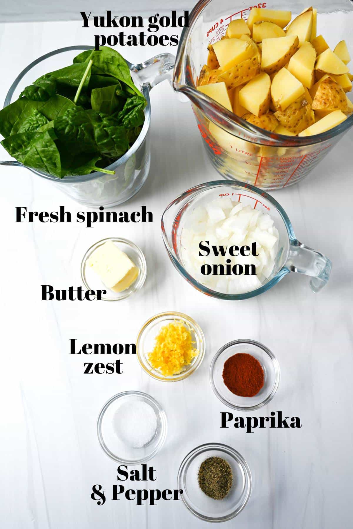 ingredients for sauteed potatoes and spinach measured out on a counter