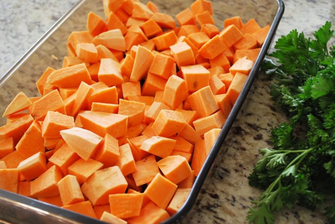 chopped sweet potatoes in a baking dish