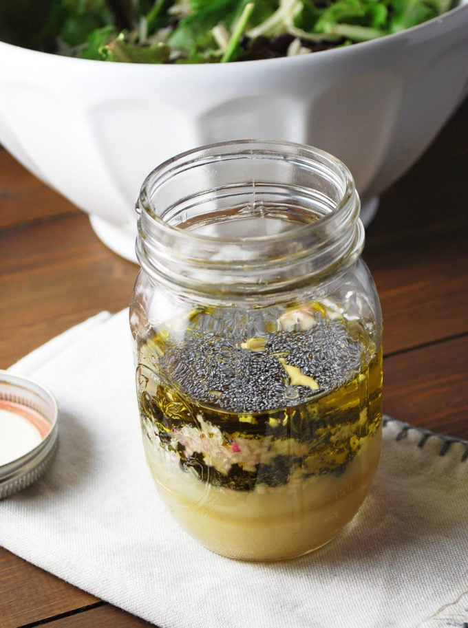 Dressing ingredients in a mason jar ready to shake and mix