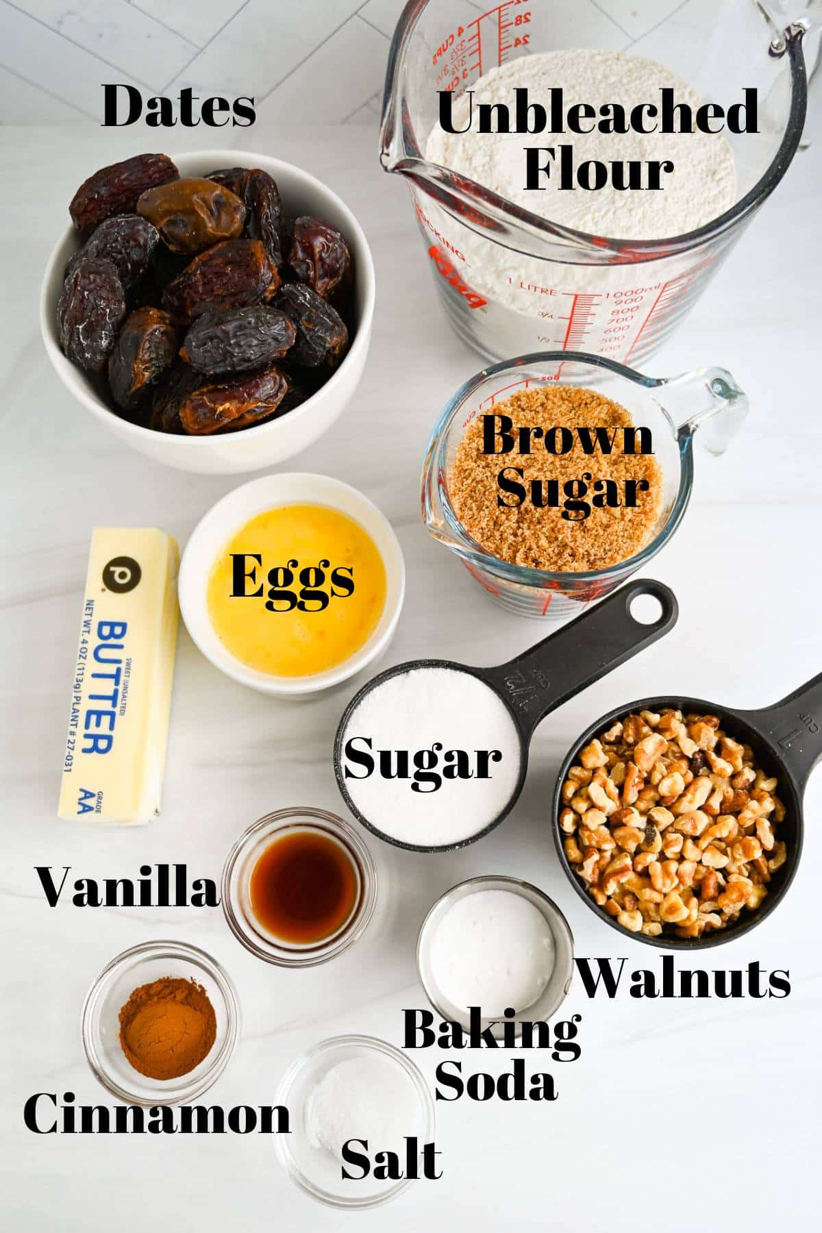 ingredients for a date walnut cake measured out on a counter