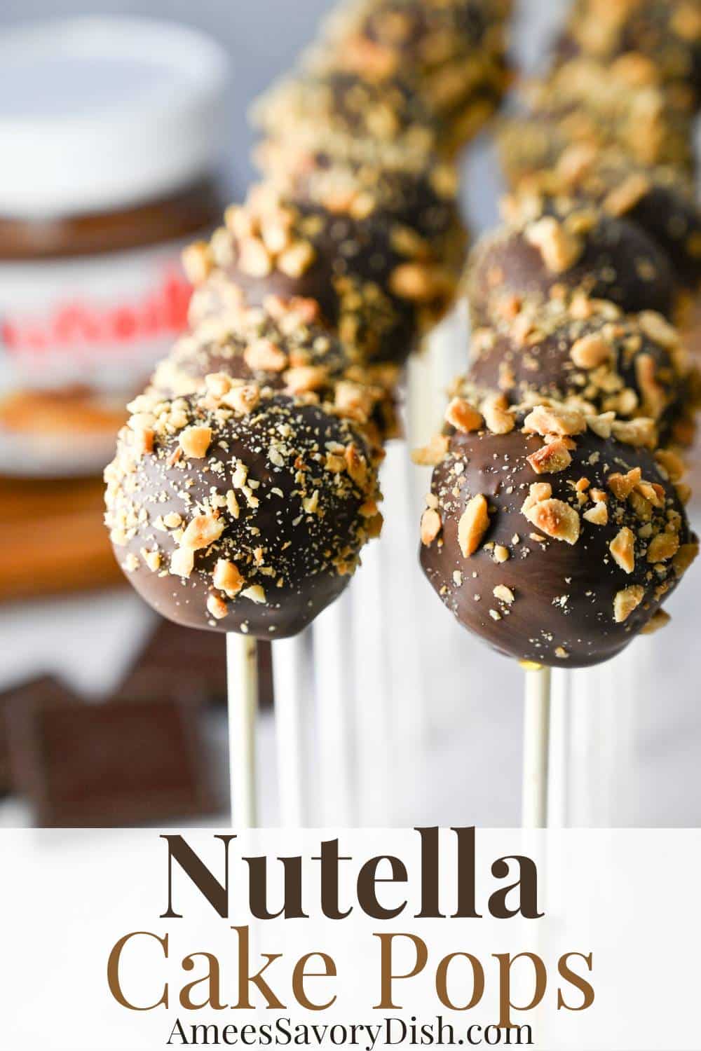 This easy Nutella Cake Pops recipe delivers an irresistible mash-up of rich chocolate cake, creamy chocolate hazelnut spread, and chopped hazelnuts on a stick! via @Ameessavorydish