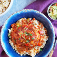 sweet and spicy crock pot chicken in a blue bowl