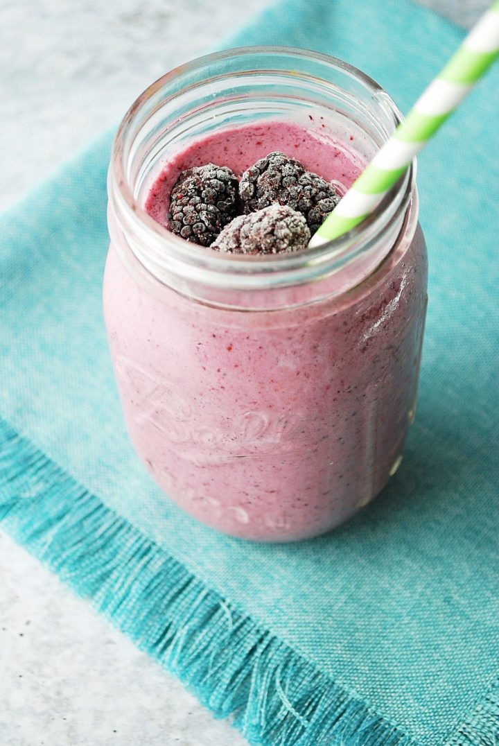 smoothie in a glass on a teal napkin