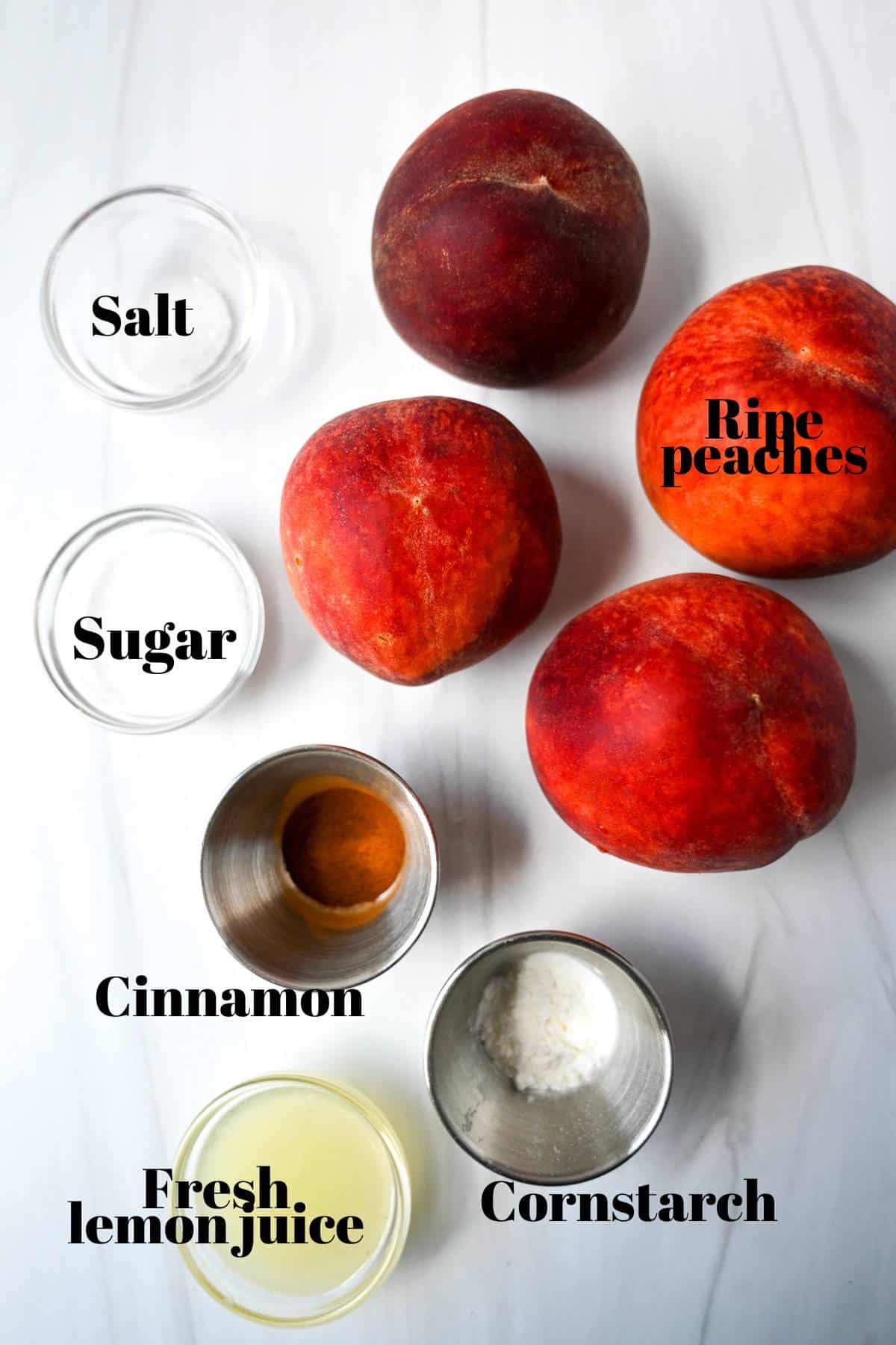 ingredients for the peach crisp filling measured out on a counter