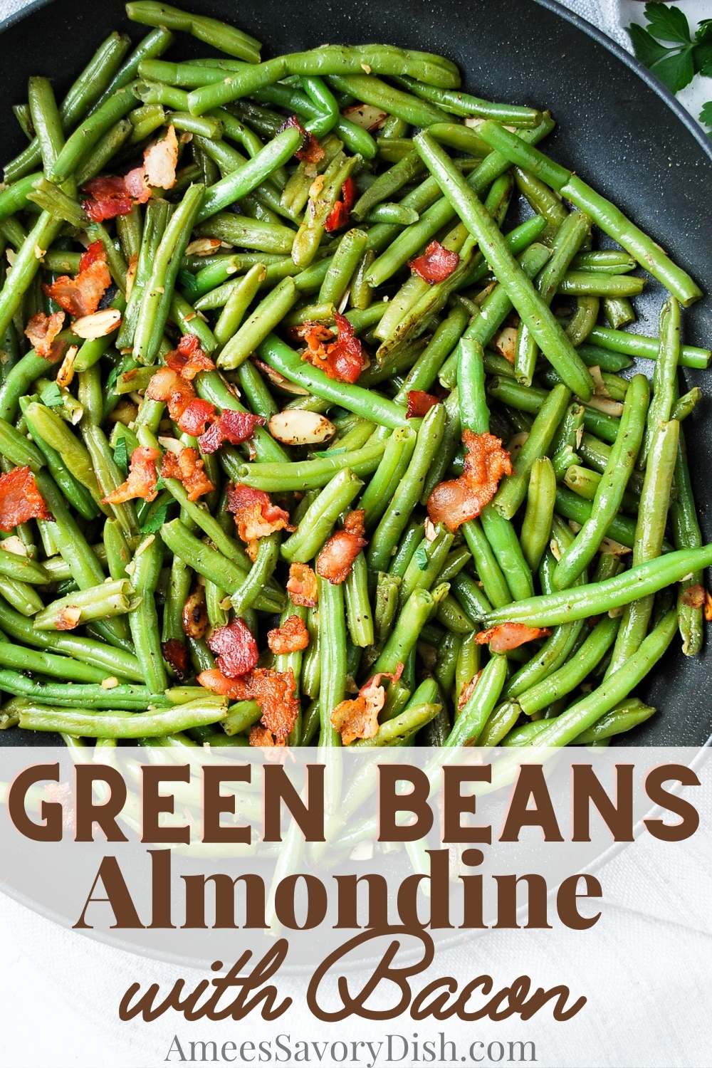 Perfectly sauteed greens beans tossed with crunchy almonds and crisp bacon crumbles—a quick and easy holiday side dish. via @Ameessavorydish