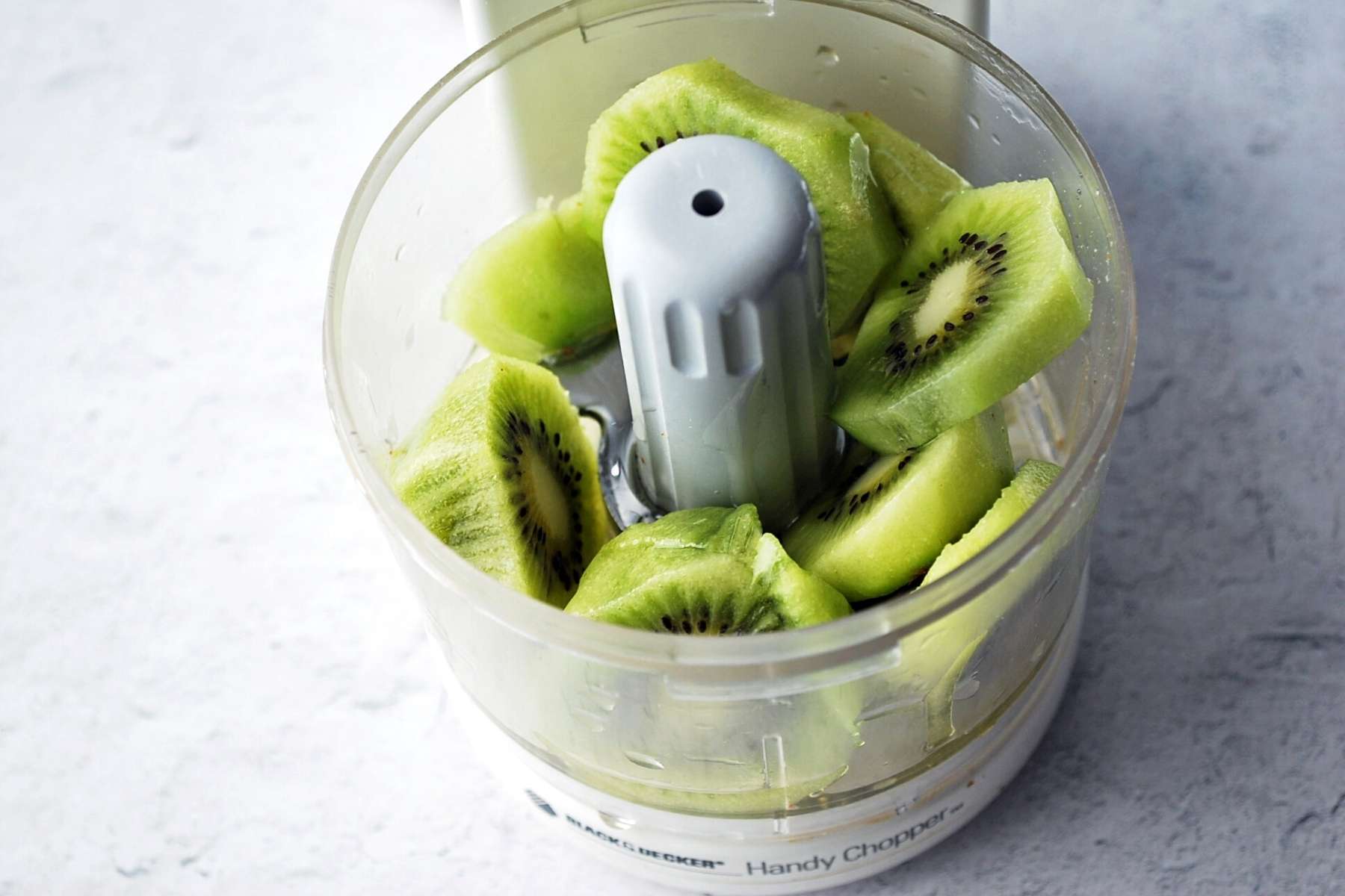 sliced kiwi fruit in a mini food processor