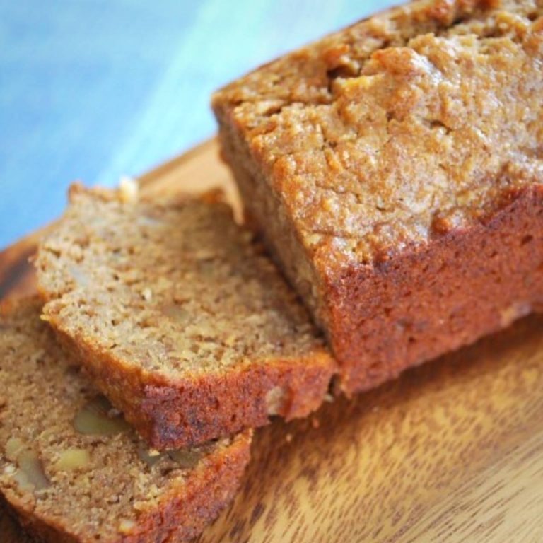 sliced banana bread on a wood cutting board