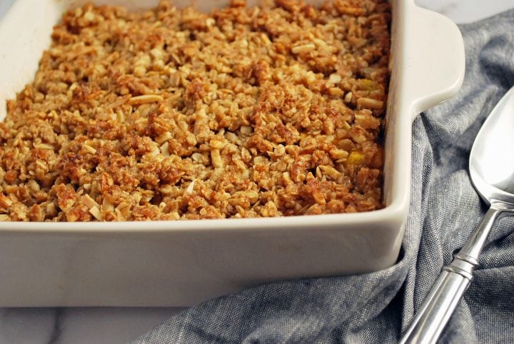 Cooked peach crisp in a baking dish 