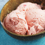 A close up of a bowl of frozen fruit ice cream