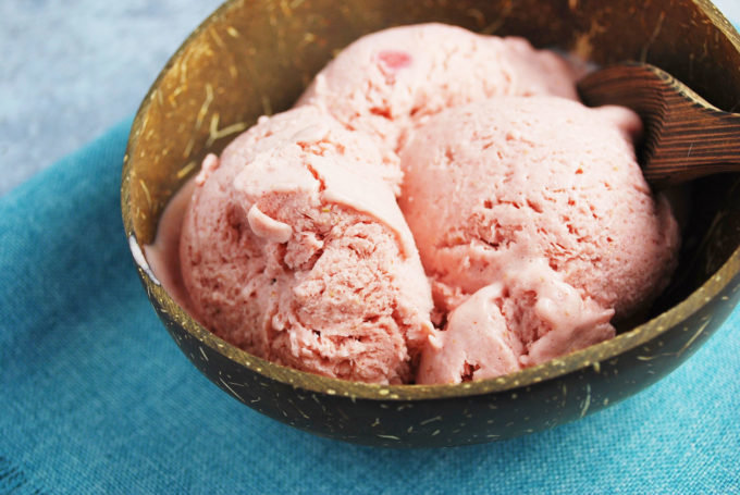 A close up of a bowl of frozen fruit ice cream